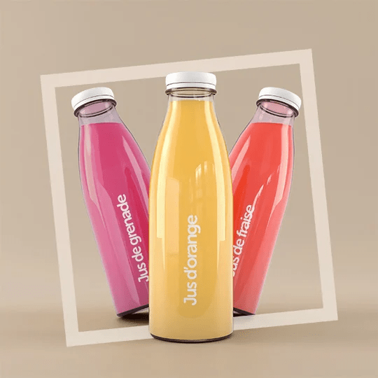 Botellas de tres colores morado, amarillo y naranja con etiquetas transparentes personalizadas