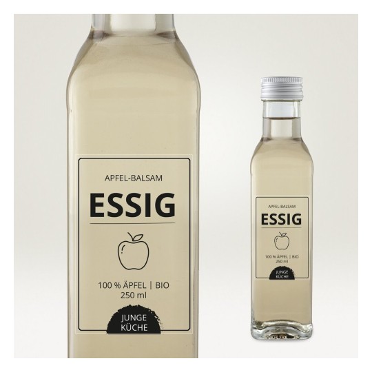 Una botella de vinagre de manzana. Etiqueta indica '100 % Äpfel | BIO', volumen de 250 ml, marca 'Junge Küche'.