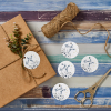 Paquete de regalo con etiqueta colgante personalizada con el texto "gracias"