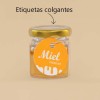 Tarro de miel con etiqueta redonda colgantes personalizadas. En el fondo el texto: etiquetas colgantes