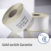 La imagen muestra rollos de etiquetas con una dirección y el texto 'Geld zurück Garantie', lo que significa 'garantía de devolución de dinero' en alemán.